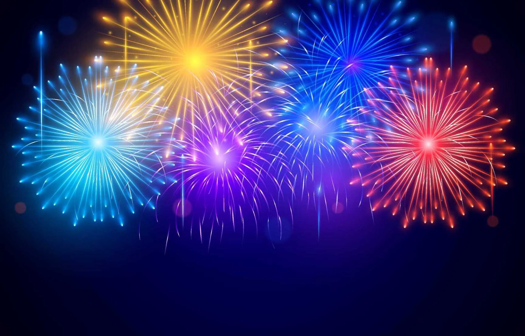 Wide fireworks display near a large building